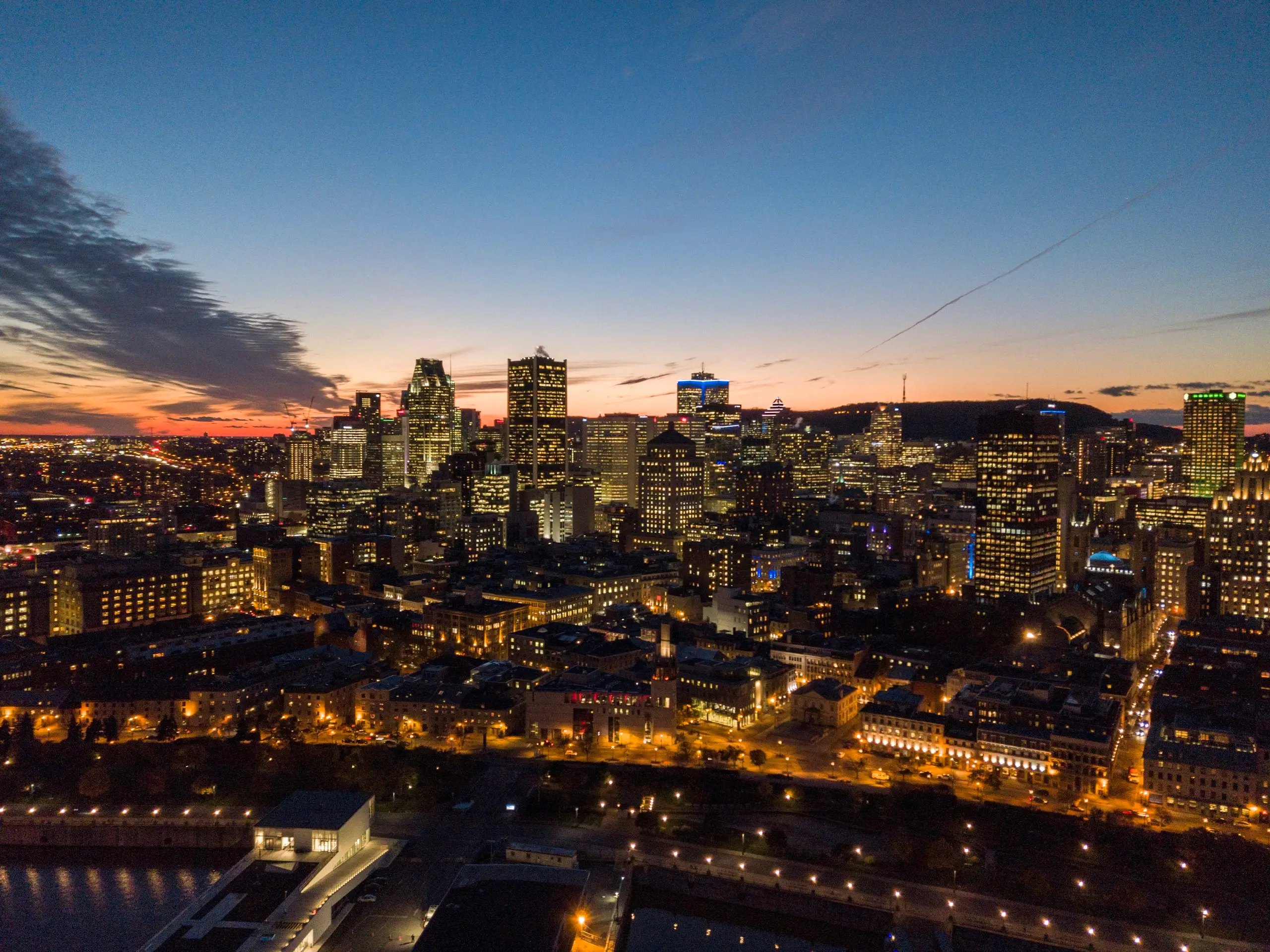 The downtown Montreal skyline glowing at dusk
