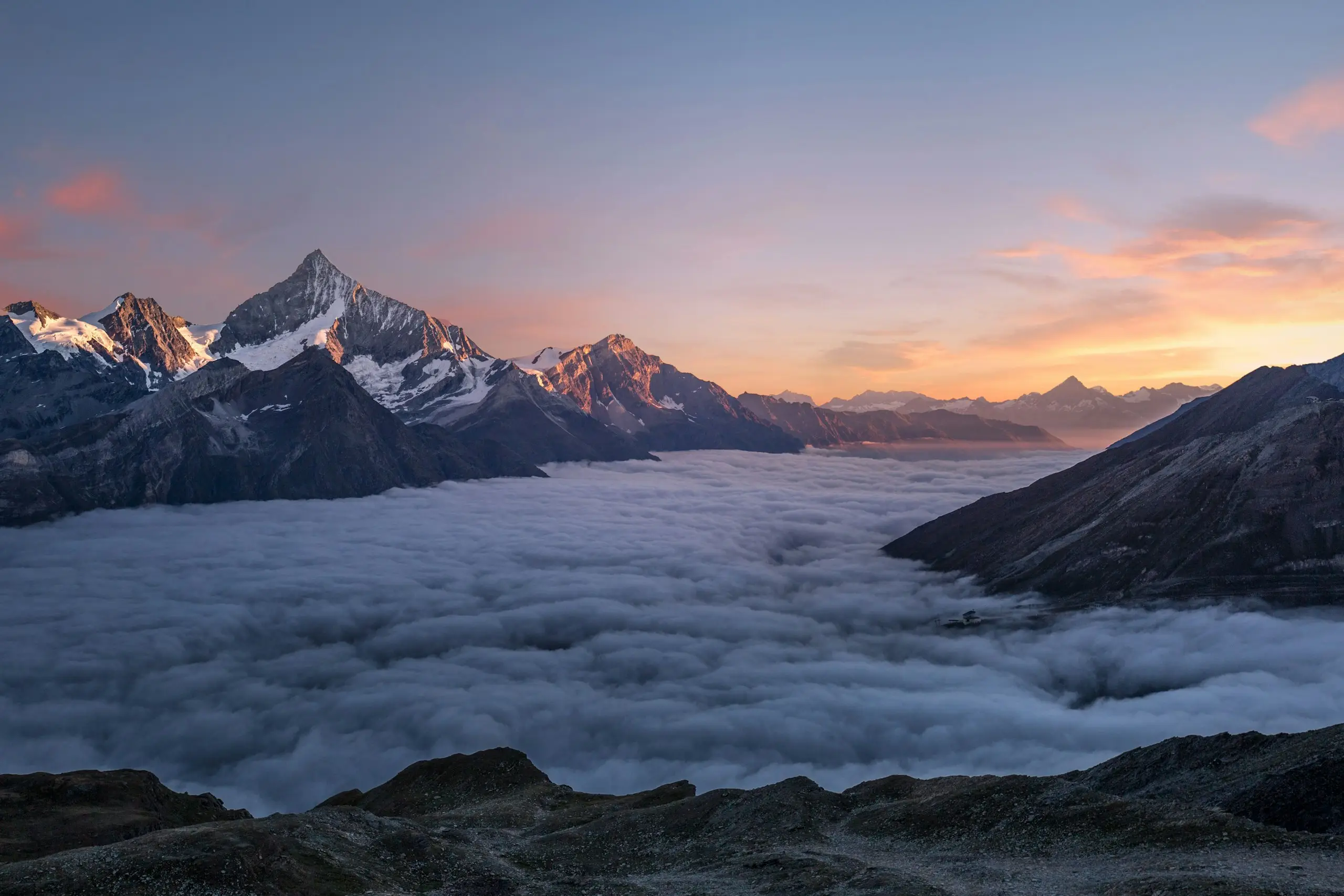 Peaks rising above a sea of cloud at sunrise near Kamloops