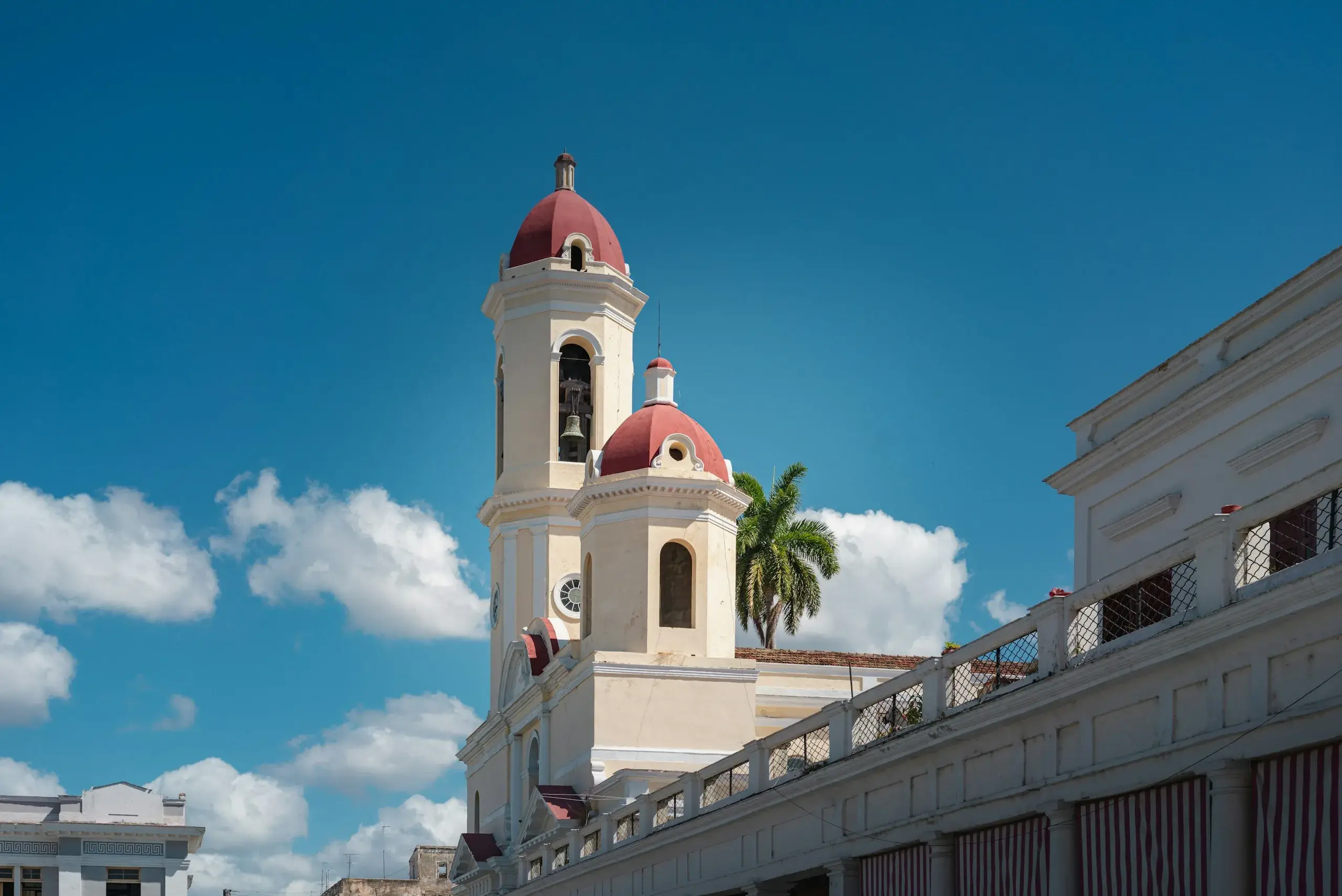Bell towers of the Cienfuegos cathedral against a blue sky