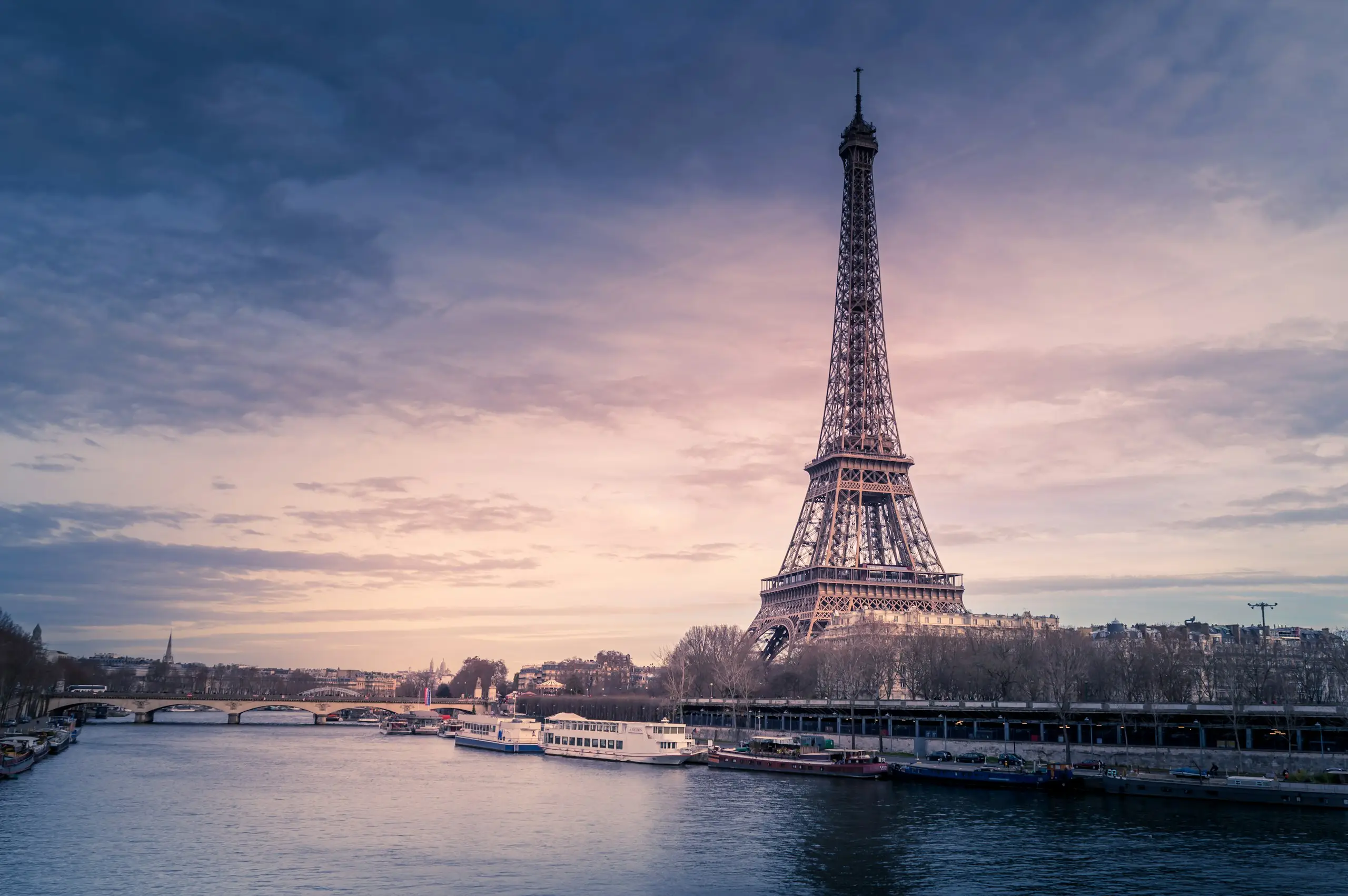 The Eiffel Tower rising above the Seine at dusk, Paris