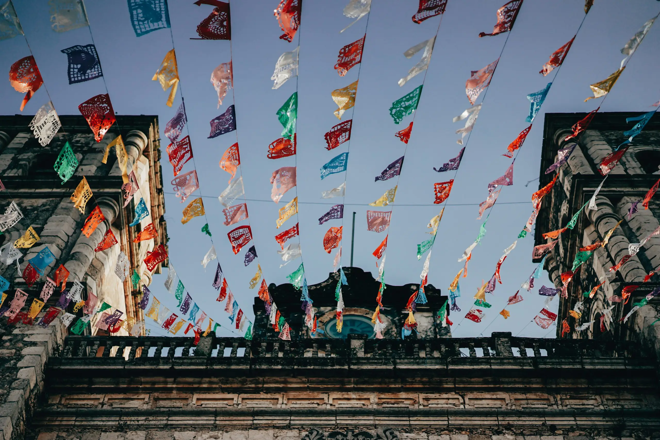 Colourful papel picado banners strung over a street, Ixtapa, Mexico
