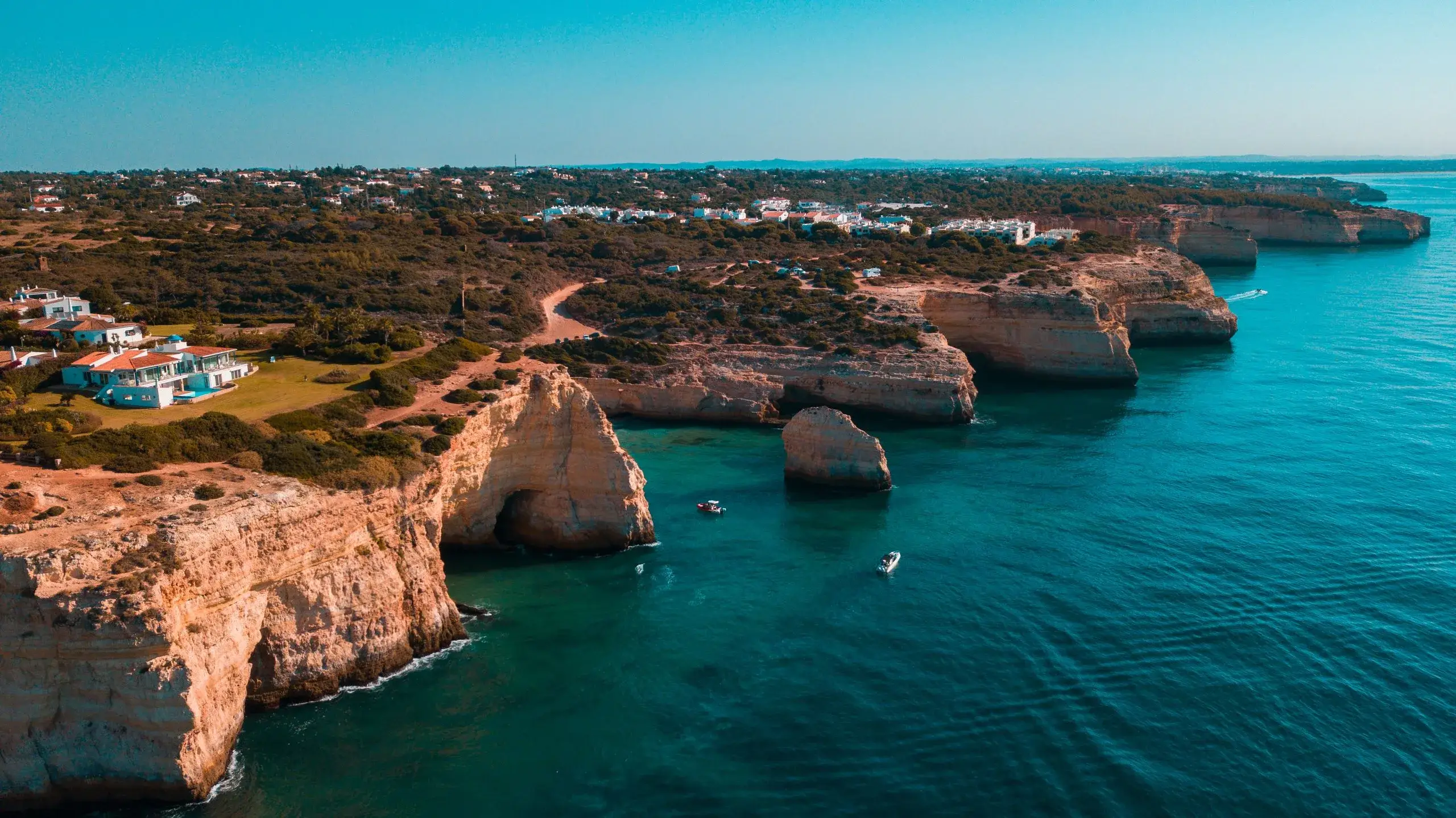 Aerial view of Algarve sea cliffs and rock arches near Carvoeiro