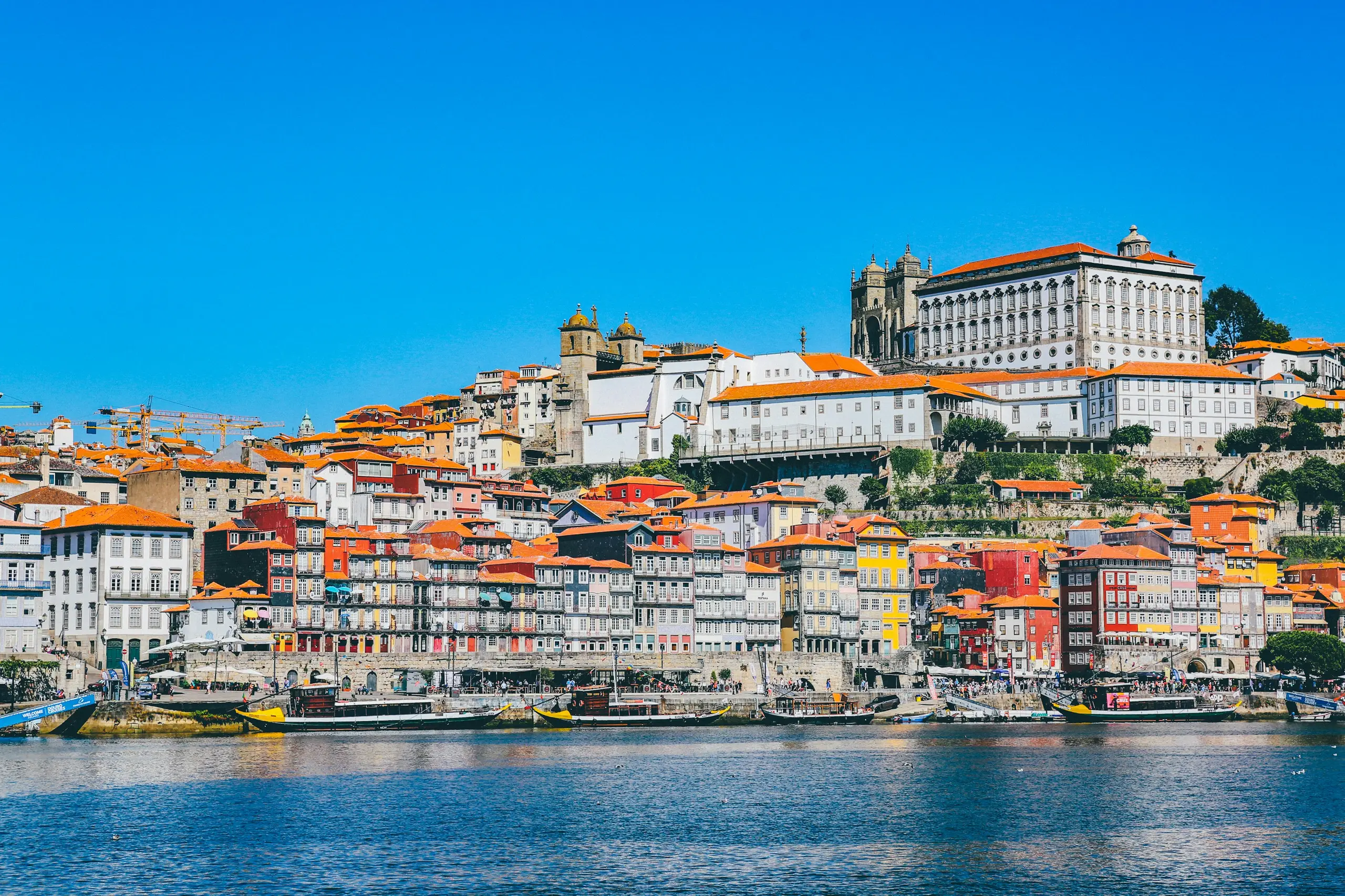 The colourful Ribeira houses rising above the Douro riverfront, Porto, Portugal