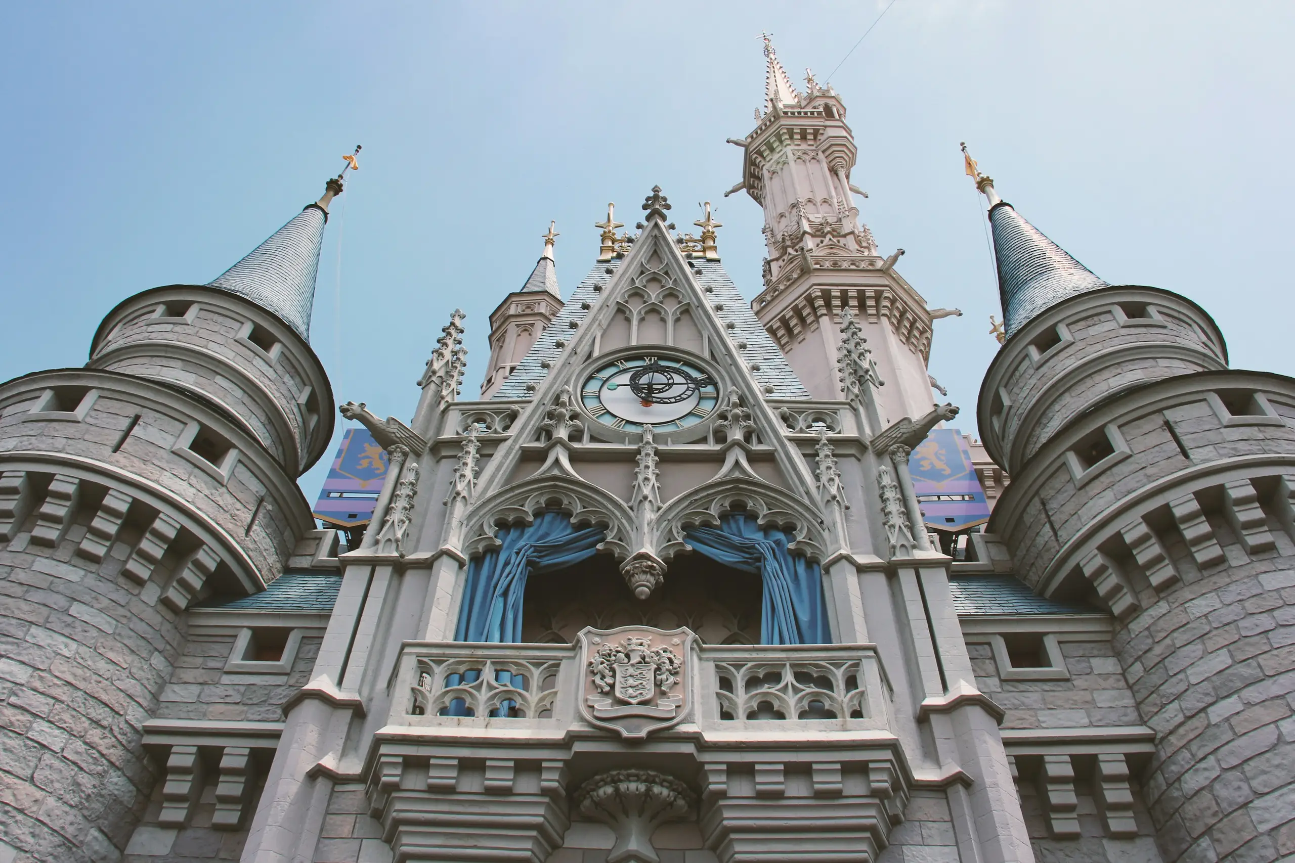 A fairytale castle with tall spires under a blue sky, Orlando, Florida