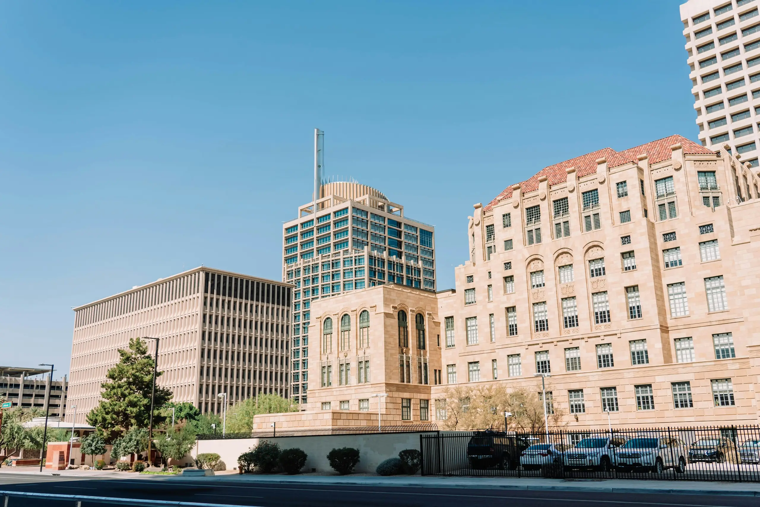 Sandstone and glass buildings of downtown Phoenix under a clear desert sky, Arizona