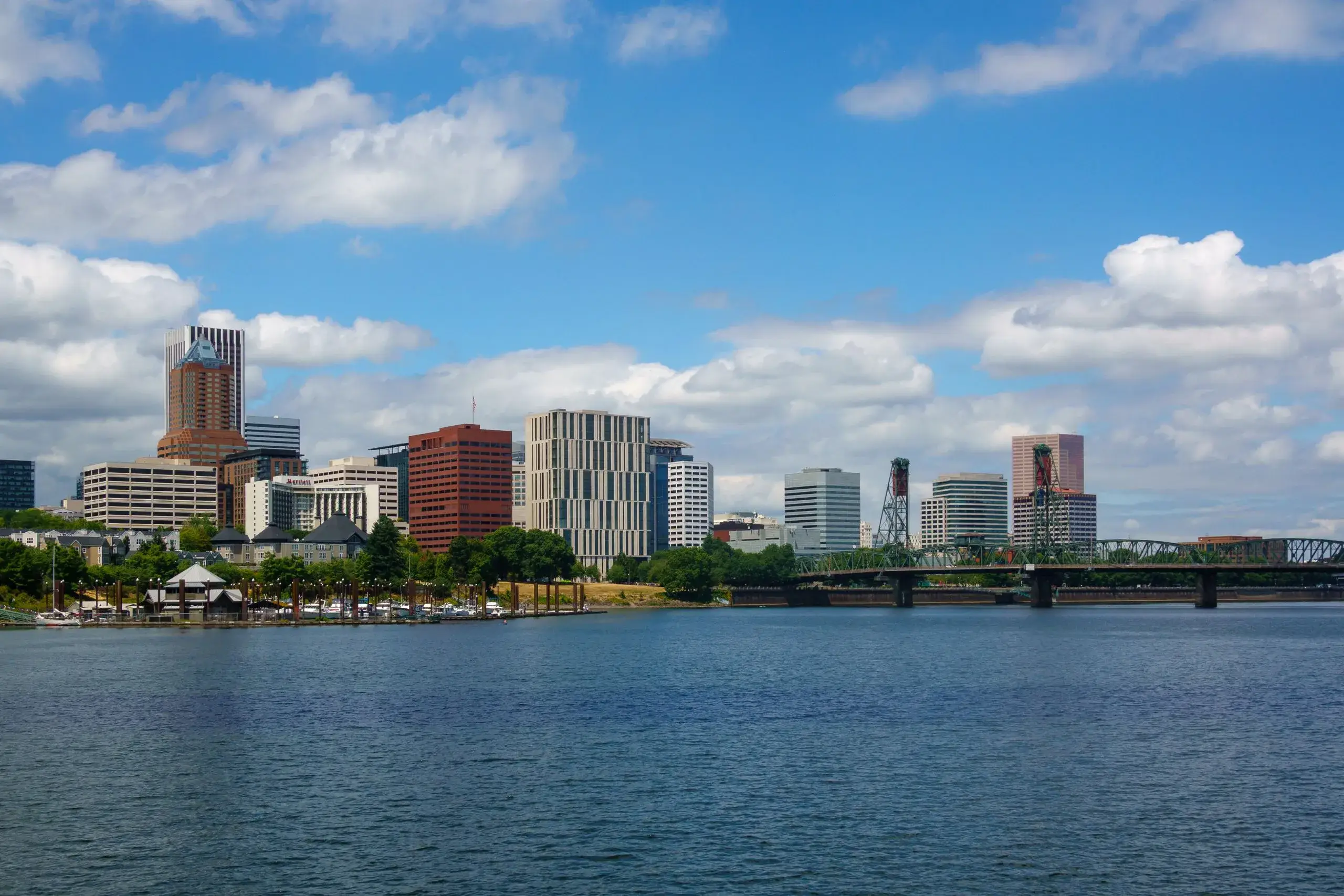 The Portland skyline across the Willamette River on a sunny day
